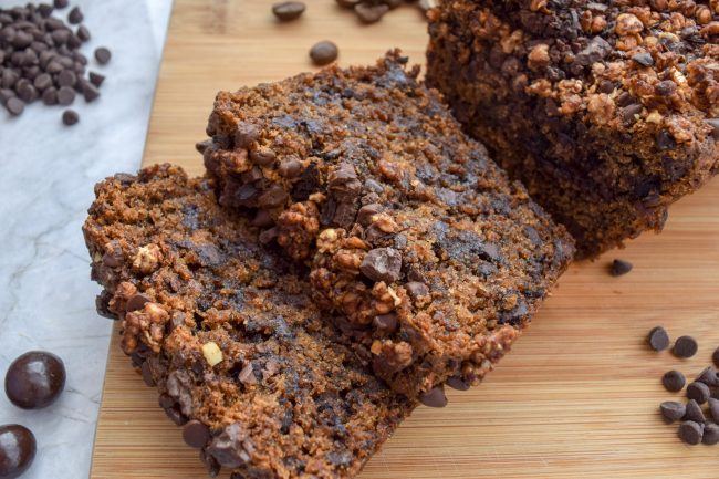 Sliced Loaf of Coffee Banana Bread With Chocolate Chips & Chocolate-Covered Coffee Beans #recipe | Vitacost.com/blog