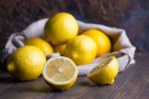 Bright Lemons Falling out of Bag on Table | Vitacost.com/Blog