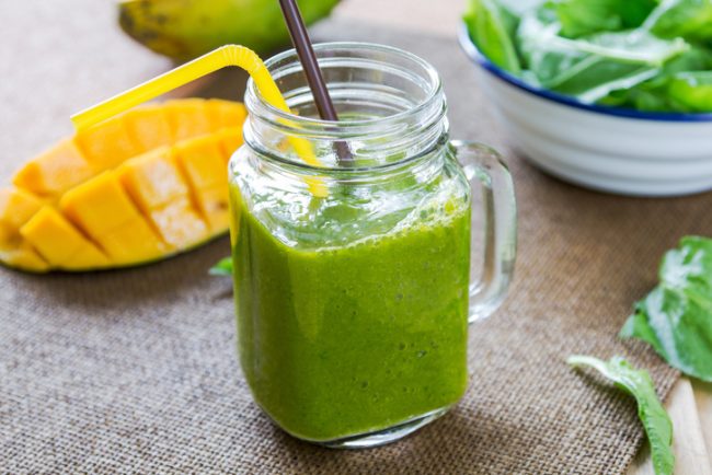 Green Smoothie with Bee Pollen Recipe Bee Pollen Green Smoothie in Clear Jar with Mango & Spinach Leaves | Vitacost.com/blog