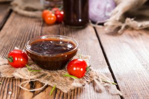 Glass Bowl of Homemade Honey BBQ Sauce on Wood | Vitacost.com/blog