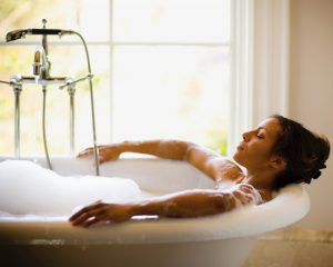 Woman in Bathtub by Window Enjoys the At-Home Spa Gifts She Got for Mother’s Day | Vitacost.com/blog