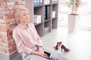 Woman Practicing Meditation and Breath Work to Calm Her Mind at Work | Vitacost.com/Blog