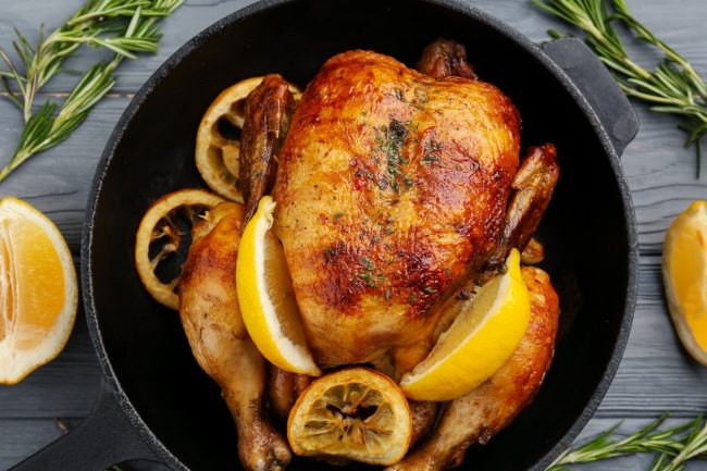 Pollo al Mattone Recipe (Chicken Under a Brick) Whole Chicken al Mattone With Lemon Wedges in Cast Iron Skillet #recipe | Vitacost.com/blog