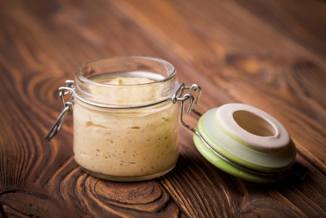 Vegan Mayonnaise Recipe Vegan Mayonnaise in Glass Jar on Wood Background