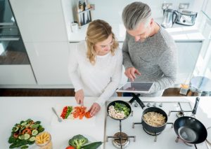 Couple Cooking in Effort to Make Healthy Changes to Ward Off Osteoarthritis Pain | Vitacost.com/blog