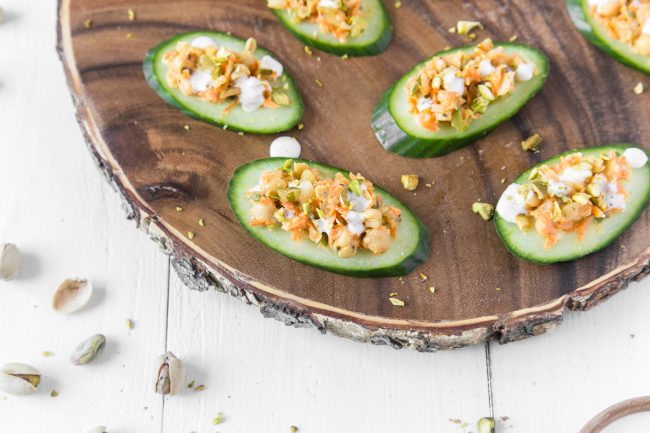 Buffalo Chickpea Salad on Cucumber Rounds on Wooden Serving Stand | Vitacost.com/blog