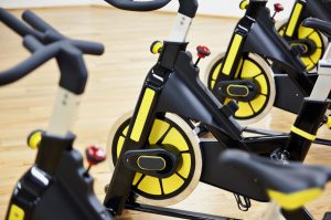 Row of Yellow SoulCycle Spin Class Bikes in Spin Room: Here’s How to Prepare for the Workout | Vitacost.com/blog