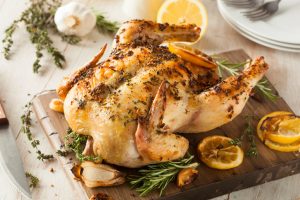 Oven Roasted Lemon Rosemary Chicken on Wood Cutting Board | Vitacost.com/blog