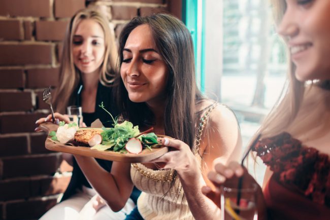 Woman Holding Plate with Healthy Foods at Party | Vitacost.com/Blog