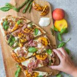 Homemade Grilled Summer Peach Pizza on Wooden Cutting Board | Vitacost.com/Blog