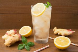Ginger-Lemon Detox with Fresh Lemon on Wood Background | Vitacost Blog