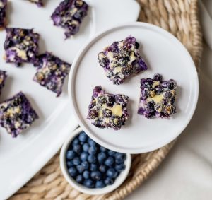 Blueberry Pie Bars on White Serving Dishes & Bowl of Blueberries #recipe | Vitacost.com/blog