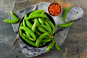 Bowl of Spicy Roasted Sugar Snap Peas | Vitacost.com/blog