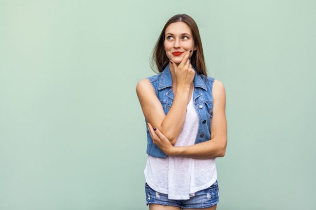 Young Woman in Denim Shorts & Jacket Wonders: What Do Probiotics Do? Do I Need Probiotics? | Vitacost.com/blog
