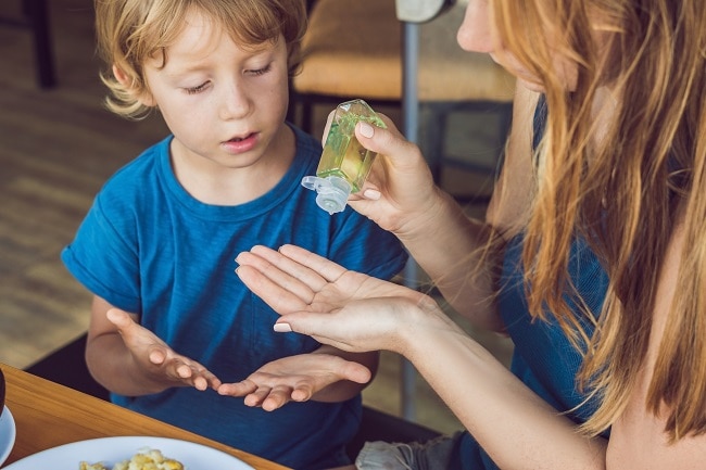 Mother Squirting Homemade Hand Sanitizer in Child's Hands | Vitacost.com/Blog