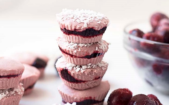 Frozen Cherry Coconut Cups Stack of Frozen Cherry Coconut Cups Next to Whole Cherries | Vitacost.com/blog