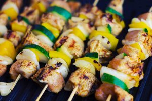 Closeup of Greek Chicken Kebabs with Greens on Grill | Vitacost Blog