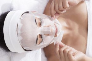 Woman in Spa Setting Enjoying Sheet Mask Benefits for Rejuvenating Skin | Vitacost.com/blog