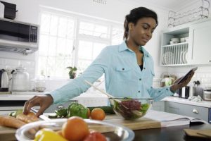 Woman Concerned About Blood Sugar Level Preparing Healthy Meal With Fresh Vegetables | Vitacost Blog