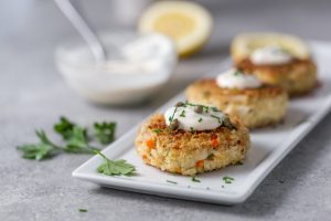 Crab Cakes Topped with Creamy Dressing and Capers | Vitacost Blog