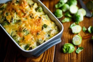 Baked Brussel Sprouts Covered with Cashew "Cheese" in Casserole Dish | Vitacost.com/blog