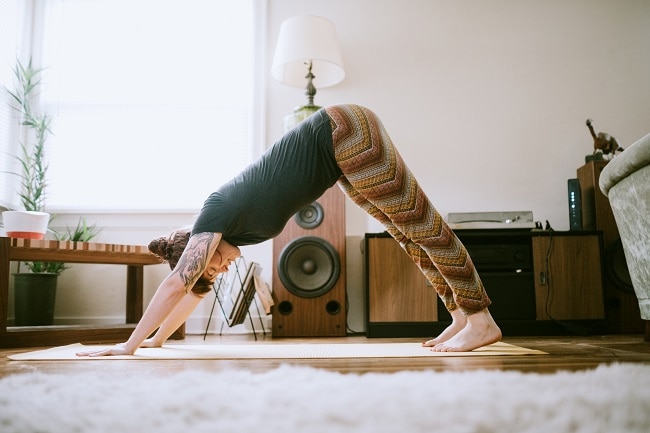 Starting Yoga? 5 Yoga Tips for Common Mistakes Woman Practicing Downward Facing Dog Yoga Pose | Vitacost.com/Blog