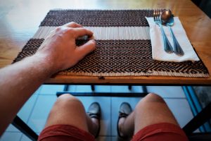 Man Who is Hungry and Angry (or Feeling Hangry) Waiting for Food at Cafe Table | Vitacost/com/blog