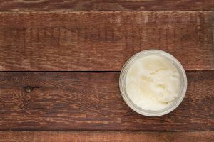 Glass Jar Filled with Coconut Oil on Wood Table | Vitacost.com/Blog