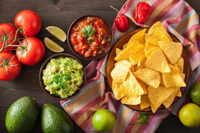 Arrangement of Healthy Mexican Food Including Guacamole, Chips and Salsa on Wooden Table | Vitacost.com/bloghttps://www.vitacost.com/mrs-renfros-gourmet-salsas-pineapple?isrc=vitablog110918paleoista