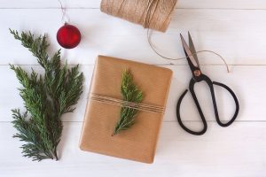 Eco-Friendly Gift Wrapped in Recyclable Paper Topped with Greens Sprig | Vitacost.com/Blog