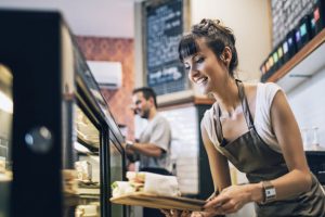 Woman Owned Business Employee Working at Shop Counter