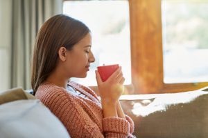 Side View of Woman With Eyes Closed Sipping Tea While Experiencing the Benefits of Mindfulness | Vitacost.com/blog