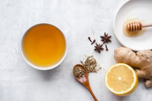 Overhead View of Winter Herbs and Lemon to Make Tea on White Marble Surface | Vitacost.com/blog