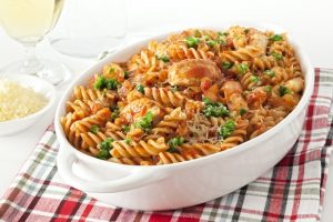 Chicken Pasta Bake Covered with Cheese in White Casserole Dish | Vitacost.com/blog