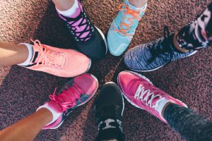 Overhead View of Women's Sneakers Arranged in Circle to Represent Concept of Finding a Fitness Buddy | Vitacost.com/blog