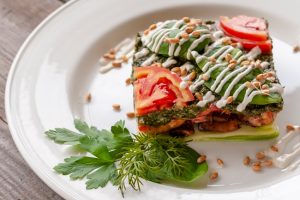 Zucchini Lasagna with Vegan Pesto & Cashew Cream on White Plate | Vitacost.com/blog