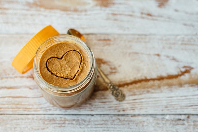 Jar of Almond Butter with Heart Drawn on Top to Represent Foods That Are Good for Your Heart | Vitacost.com/blog