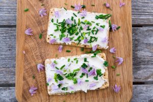 Homemade Vegan Cream Cheese Spread on Crackers with a Sprinkle of Herbs | Vitacost.com/blog