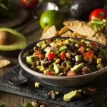 Cowboy Caviar in Black Bowl with Chips, Lime and Avocado | Vitacost.com/blog