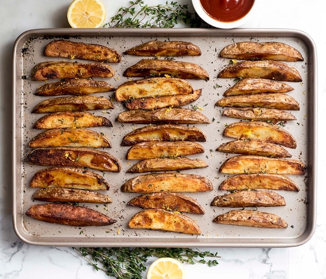 Baked Potato Wedges with Lemon & Thyme  Baked Potato Wedges on Baking Sheet | Vitacost.com/blog
