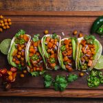 Chickpea and Sweet Potato Vegan Tacos on Large Wood Cutting Board | Vitacost.com/blog