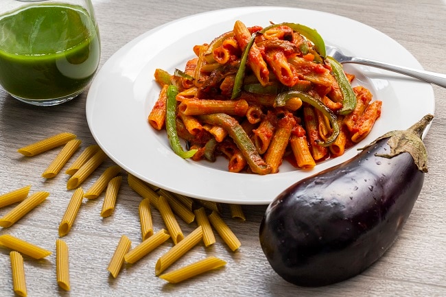 Roasted Eggplant Pasta Sauce with Lentil Pasta  Roasted Eggplant Pasta Sauce over Lentil Penne in White Bowl | Vitacost.com/blog