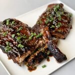 Grilled Asian Ribs on a white plate