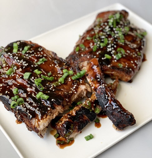 Grilled Asian Ribs on a white plate