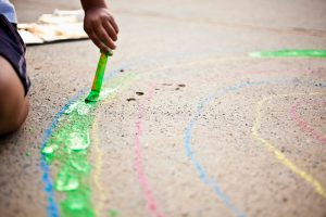 Child Drawing with Homemade Sidewalk Chalk Paint | Vitacost.com/Blog