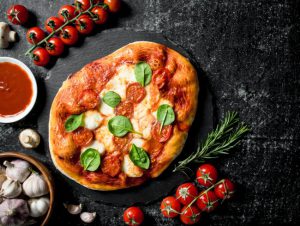 Pizza with tomato and fresh garlic