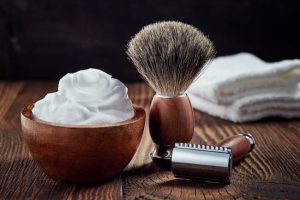Wooden Shaving Brush, Razor and Bowl on Wood Table to Represent Skin Care Tips for Men Concept | Vitacost.com/blog