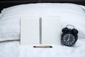 Sleep Log on Bed with Pen, Pillow and Alarm Clock | Vitacost.com/blog