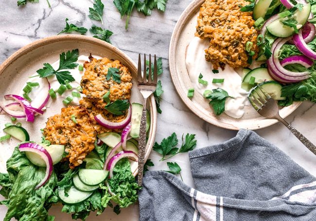 Chickpea Fritters with Cucumber and Onion Salad On White Granite | Vitacost Blog
