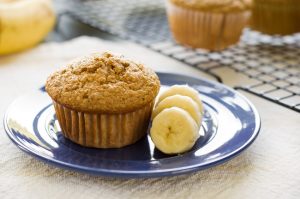 Banana Bread Muffin on Blue Plate with Sliced Bananas | Vitacost.com/blog